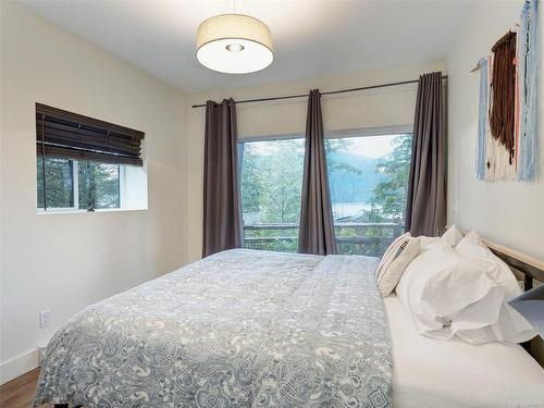 247-6596 Baird Rd, Port Renfrew, BC - Indoor Photo Showing Bedroom