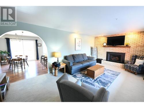 11315 94 Street, Fort St. John, BC - Indoor Photo Showing Living Room With Fireplace