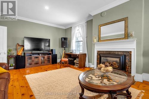 4903 County 45 Road, Hamilton Township, ON - Indoor Photo Showing Living Room With Fireplace