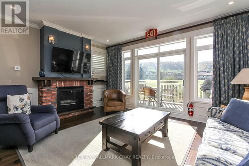#241 -130 Fairway Crt, Blue Mountains, ON - Indoor Photo Showing Living Room With Fireplace