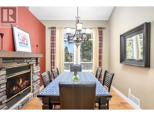 9283 Chinook Road, Vernon, BC - Indoor Photo Showing Dining Room With Fireplace