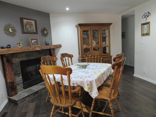 2015 Highway 3A, Castlegar, BC - Indoor Photo Showing Dining Room With Fireplace