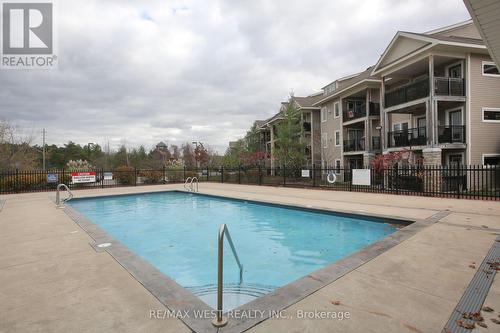 203 - 1 Brandy Lane Drive, Collingwood, ON - Outdoor With Balcony With Facade