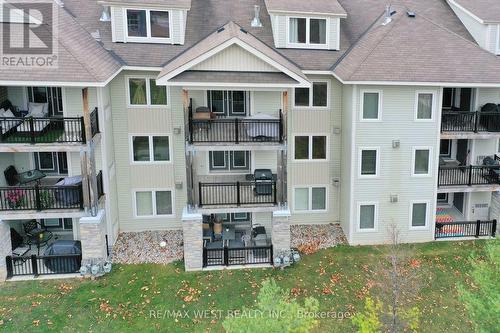 203 - 1 Brandy Lane Drive, Collingwood, ON - Outdoor With Balcony With Facade