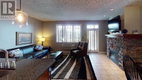 400 Bighorn Boulevard Unit# 412 A, Radium Hot Springs, BC - Indoor Photo Showing Living Room With Fireplace