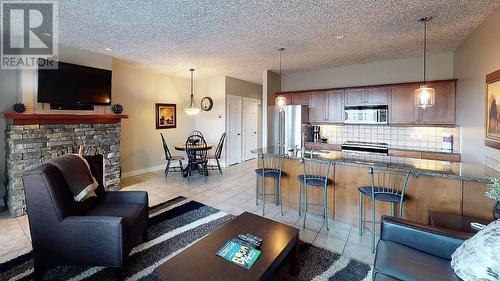 400 Bighorn Boulevard Unit# 412 A, Radium Hot Springs, BC - Indoor Photo Showing Living Room With Fireplace