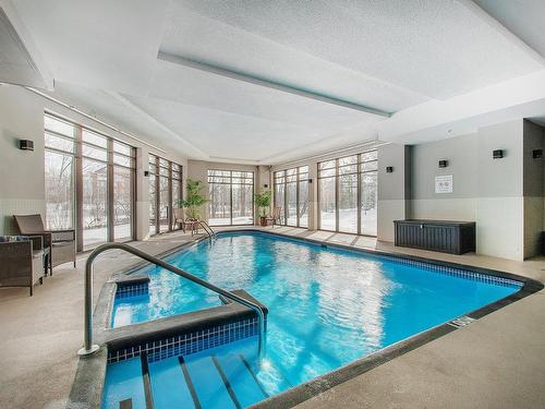 Piscine - 801-4500 Ch. Des Cageux, Laval (Chomedey), QC - Indoor Photo Showing Other Room With In Ground Pool