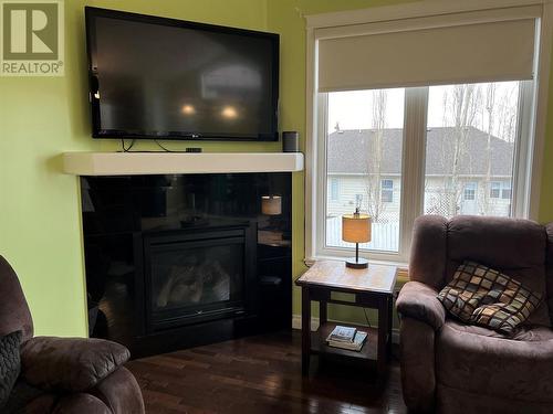8809 19A Street, Dawson Creek, BC - Indoor Photo Showing Living Room With Fireplace