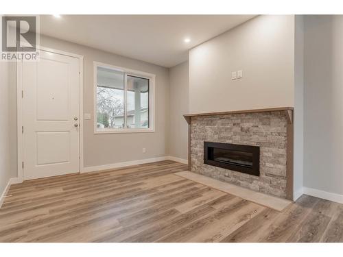 5830 Okanagan Street Unit# 103, Oliver, BC - Indoor Photo Showing Living Room With Fireplace