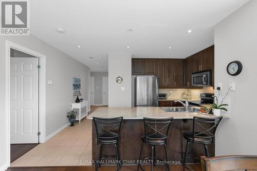 #711 -33 Ellen St, Barrie, ON - Indoor Photo Showing Kitchen With Stainless Steel Kitchen With Double Sink