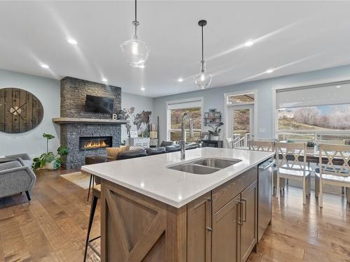 225 Kicking Horse Place, Vernon, BC - Indoor Photo Showing Kitchen With Fireplace With Double Sink