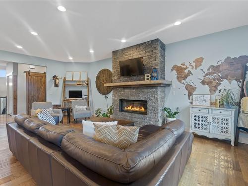 225 Kicking Horse Place, Vernon, BC - Indoor Photo Showing Living Room With Fireplace