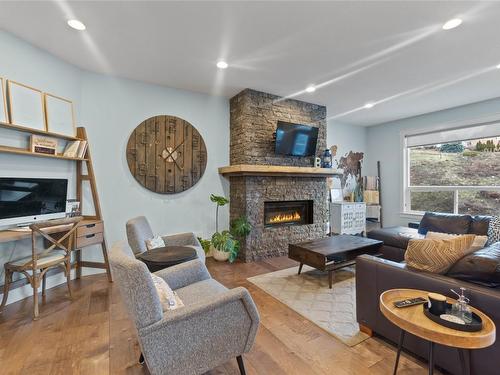 225 Kicking Horse Place, Vernon, BC - Indoor Photo Showing Living Room With Fireplace