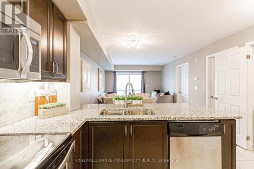 #211 -1045 Nadalin Hts, Milton, ON - Indoor Photo Showing Kitchen With Double Sink With Upgraded Kitchen