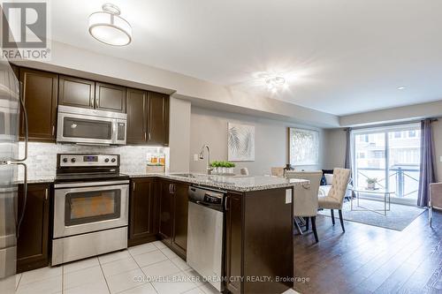 #211 -1045 Nadalin Hts, Milton, ON - Indoor Photo Showing Kitchen With Stainless Steel Kitchen With Upgraded Kitchen