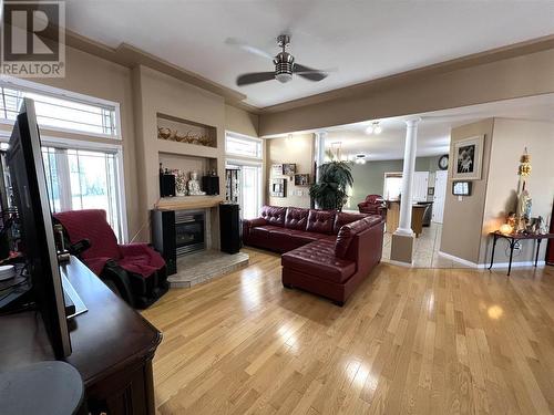 2 6550 Old Alaska Highway, Fort Nelson, BC - Indoor Photo Showing Living Room With Fireplace