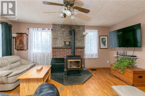 150 Sir Johns Crescent Highway, Shallow Lake, ON - Indoor Photo Showing Living Room With Fireplace