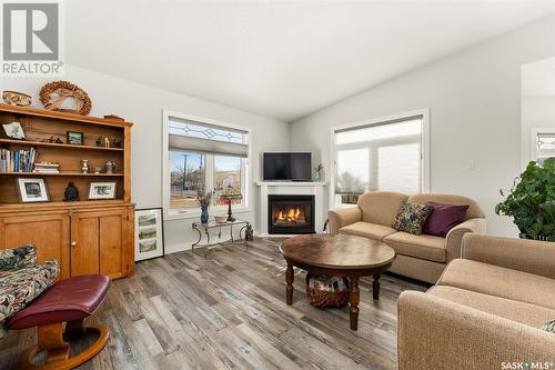 7 802 2Nd Avenue Nw, Moose Jaw, SK - Indoor Photo Showing Living Room With Fireplace