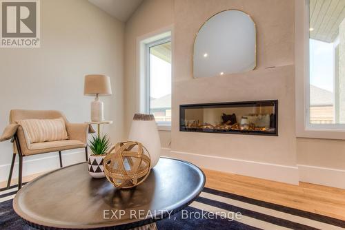 19 Carriage Crossing, Mapleton, ON - Indoor Photo Showing Living Room With Fireplace