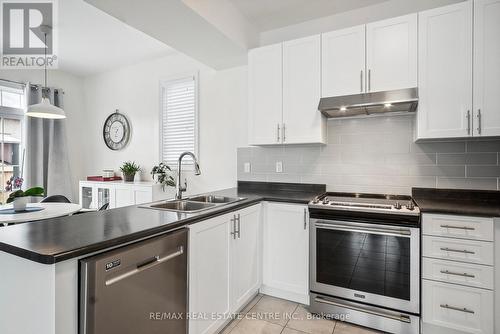 8 Falvo Street, Wasaga Beach, ON - Indoor Photo Showing Kitchen With Double Sink