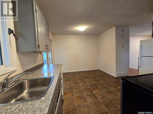 A & B 9012 Panton Avenue, North Battleford, SK - Indoor Photo Showing Kitchen With Double Sink