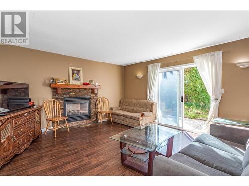 483 Parfitt Court, Kelowna, BC - Indoor Photo Showing Living Room With Fireplace