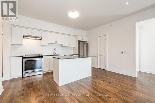 402 - 299 Cundles Road E, Barrie, ON - Indoor Photo Showing Kitchen With Upgraded Kitchen