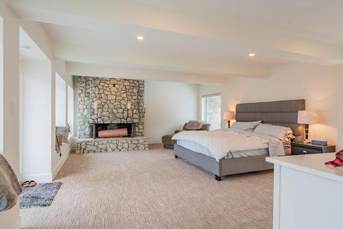 3429 8Th Avenue, Castlegar, BC - Indoor Photo Showing Bedroom With Fireplace
