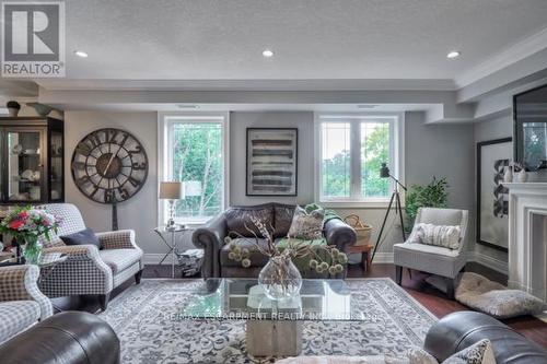 #306 -390 Upper Middle Rd E, Oakville, ON - Indoor Photo Showing Living Room With Fireplace