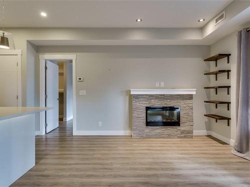 103-1883 Water Street, Kelowna, BC - Indoor With Fireplace