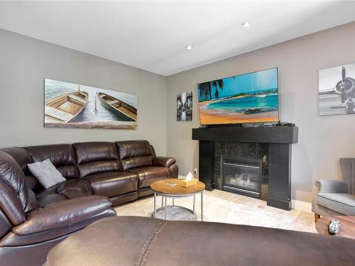 4932 Windsong Crescent, Kelowna, BC - Indoor Photo Showing Living Room With Fireplace