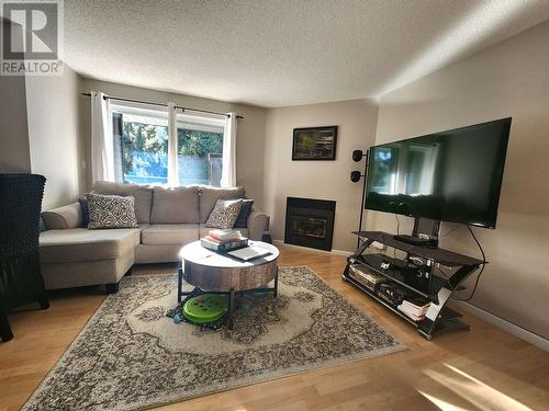 202 3033 Ospika Boulevard, Prince George, BC - Indoor Photo Showing Living Room With Fireplace