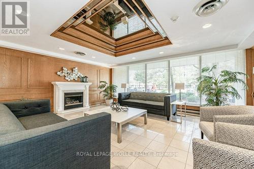 #1601 -4 Willow St, Waterloo, ON - Indoor Photo Showing Living Room With Fireplace