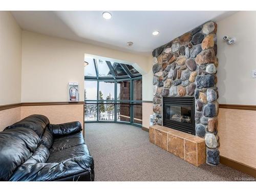 208-1280 Alpine Rd, Courtenay, BC - Indoor Photo Showing Living Room With Fireplace