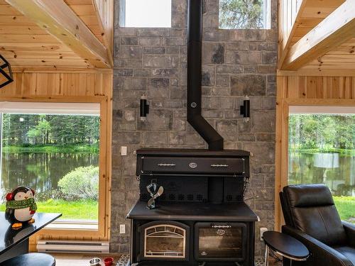 Dining room - 1288 Route 138, Petite-Rivière-Saint-François, QC - Indoor Photo Showing Other Room With Fireplace