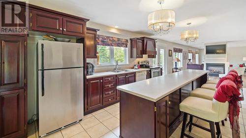 40-44 Summit Drive, Paradise, NL - Indoor Photo Showing Kitchen With Fireplace With Double Sink