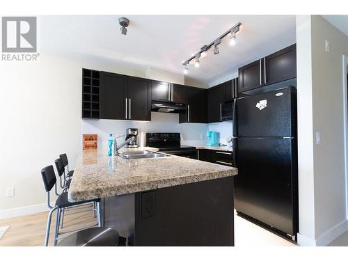 1093 Sunset Drive Unit# 310, Kelowna, BC - Indoor Photo Showing Kitchen With Double Sink