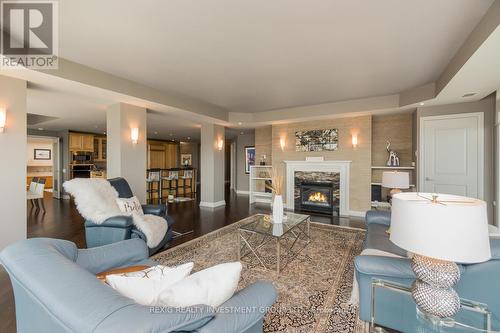 Ph10 - 1055 Southdown Road W, Mississauga, ON - Indoor Photo Showing Living Room With Fireplace