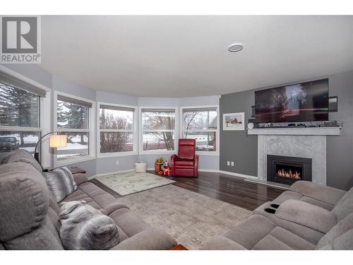 1877 Maple Street, Lumby, BC - Indoor Photo Showing Living Room With Fireplace