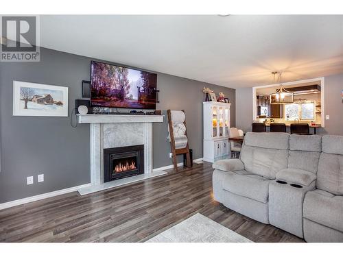 1877 Maple Street, Lumby, BC - Indoor Photo Showing Living Room With Fireplace