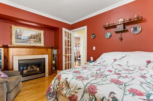8069 # 3 Highway W, Haldimand County, ON - Indoor Photo Showing Bedroom With Fireplace