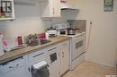 207 3Rd Avenue W, Kindersley, SK  - Indoor Photo Showing Kitchen With Double Sink 