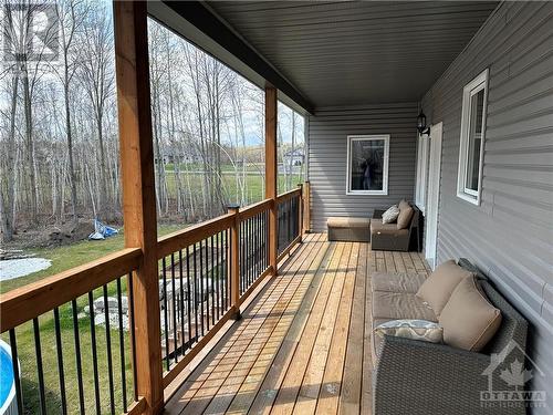 Long covered back porch - 306 Athabasca Way, Kemptville, ON - Outdoor With Deck Patio Veranda With Exterior
