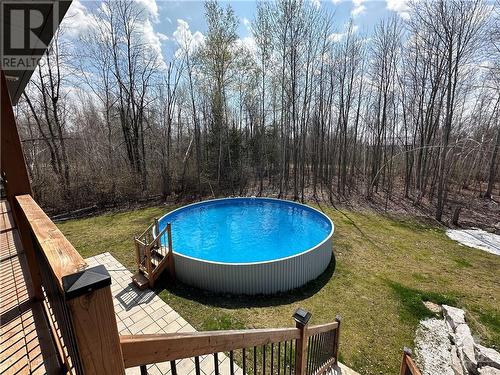 Above ground pool off of covered porch - 306 Athabasca Way, Kemptville, ON - Outdoor With Above Ground Pool