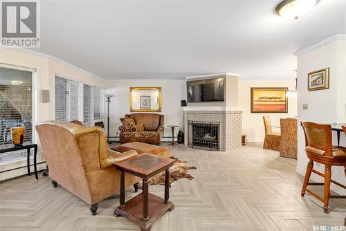 102 222 Saskatchewan Crescent E, Saskatoon, SK - Indoor Photo Showing Living Room With Fireplace