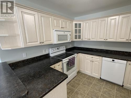 A 4415 Heritage Crescent, Fort Nelson, BC - Indoor Photo Showing Kitchen
