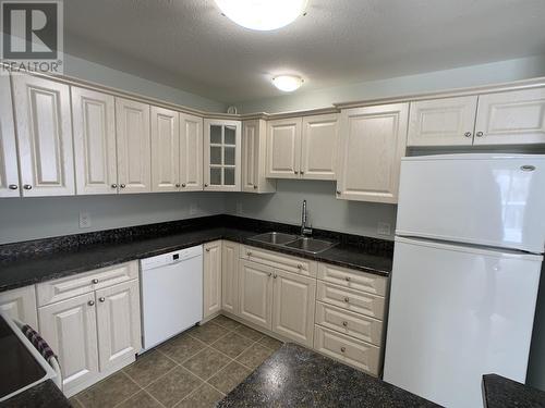 A 4415 Heritage Crescent, Fort Nelson, BC - Indoor Photo Showing Kitchen With Double Sink