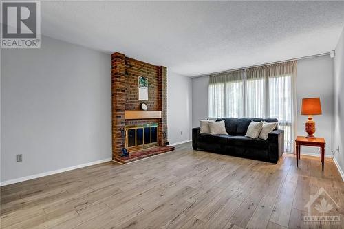 15 Rutherford Crescent, Ottawa, ON - Indoor Photo Showing Living Room With Fireplace
