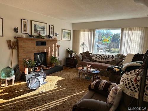 9490 Mayors Way, Port Hardy, BC - Indoor Photo Showing Living Room With Fireplace