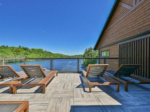 Patio - 302-50 Ch. Masson, Sainte-Marguerite-Du-Lac-Masson, QC - Outdoor With Body Of Water With Deck Patio Veranda